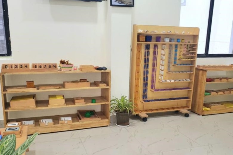 Children exploring Montessori materials in class